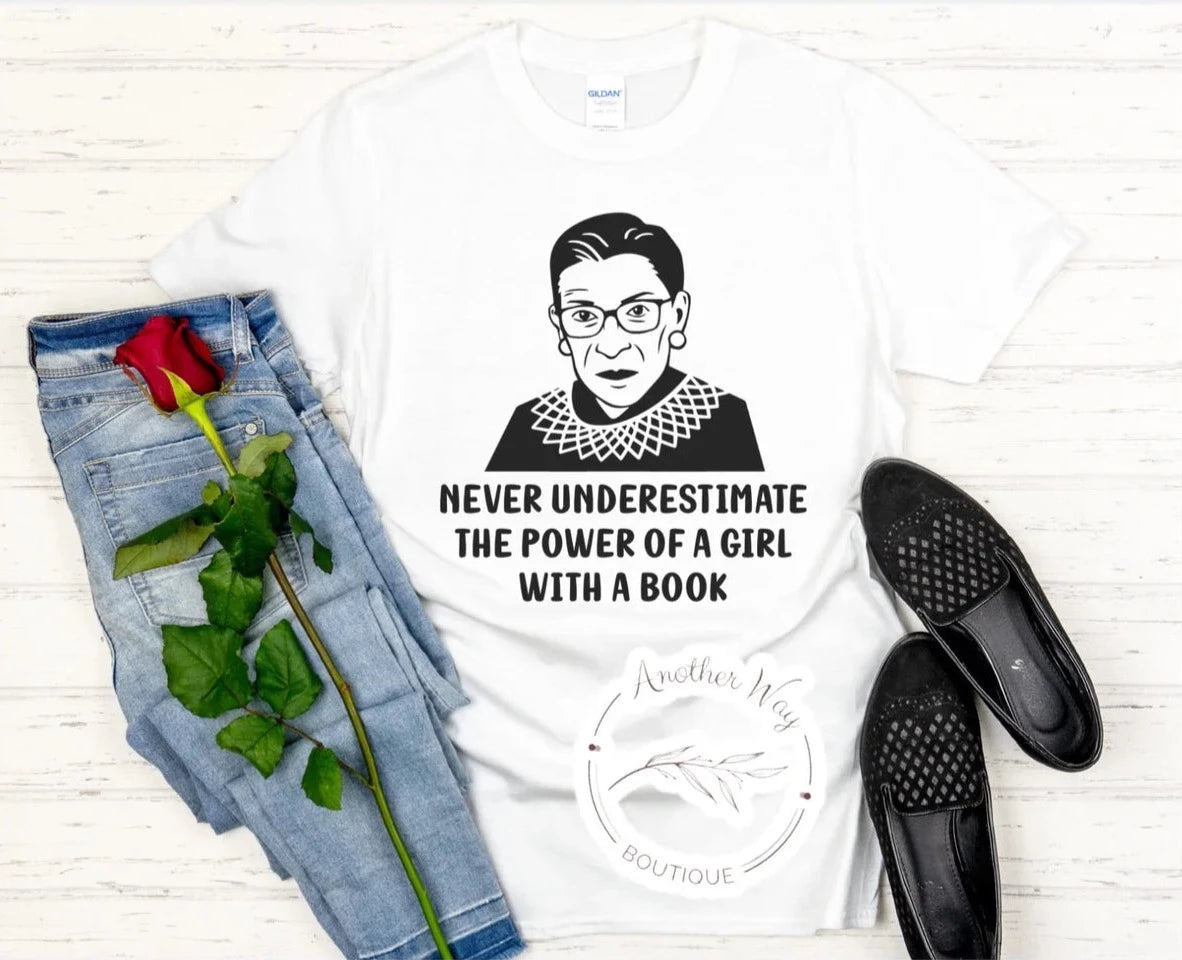 "Never underestimate the power of a girl with a book." RGB - Another Way Boutique